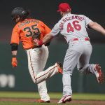
              San Francisco Giants' Brandon Crawford, left, is tagged out by St. Louis Cardinals first baseman Paul Goldschmidt (46) during a rundown during the sixth inning of a baseball game in San Francisco, Friday, May 6, 2022. (AP Photo/Jeff Chiu)
            