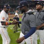 
              Houston Astros' Dusty Baker Jr., left, celebrates with players after a baseball game against the Seattle Mariners Tuesday, May 3, 2022, in Houston. The Astros won 4-0 giving Baker 2,000 career wins. (AP Photo/David J. Phillip)
            