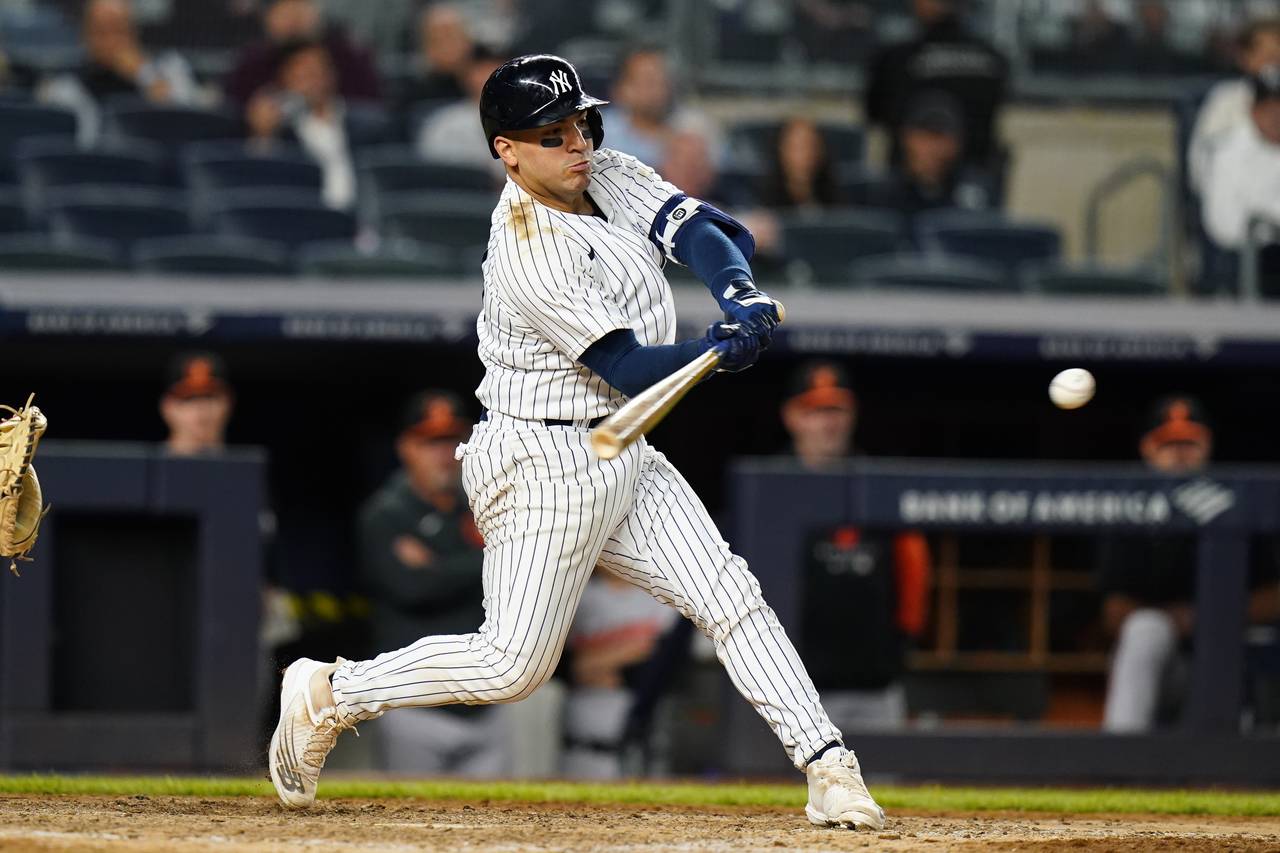 New York Yankees' Jose Trevino hits an RBI ingle during the 11th inning of the team's baseball game...