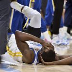 
              Golden State Warriors forward Draymond Green lies on the floor during the first half of Game 2 of the team's second-round NBA basketball playoff series against the Memphis Grizzlies on Tuesday, May 3, 2022, in Memphis, Tenn. (AP Photo/Brandon Dill)
            