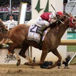 
              Rich Strike (21), with Sonny Leon aboard, crosses the finish line to win the 148th running of the Kentucky Derby horse race at Churchill Downs Saturday, May 7, 2022, in Louisville, Ky. (AP Photo/Mark Humphrey)
            