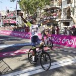 
              Eritrea's Biniam Girmay celebrates as he  crosses the finish line of the 10th stage of the Giro D'Italia cycling race from Pescara to Jesi, Italy,  Tuesday, May 17, 2022. (Massimo Paolone/LaPresse via AP)
            