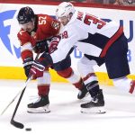 
              Florida Panthers defenseman MacKenzie Weegar (52) and Washington Capitals right wing Anthony Mantha (39) go after the puck during the second period of Game 2 of an NHL hockey first-round playoff series, Thursday, May 5, 2022, in Sunrise, Fla. (AP Photo/Marta Lavandier)
            