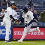 
              New York Yankees' Jose Trevino, right, celebrates with third base coach Luis Rojas as he runs the bases after hitting a home run during the third inning of a baseball game against the Baltimore Orioles on Tuesday, May 24, 2022, in New York. (AP Photo/Frank Franklin II)
            