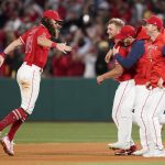
              Los Angeles Angels starting pitcher Reid Detmers (48) celebrates with teammates after throwing a no hitter against the Tampa Bay Rays in a baseball game in Anaheim, Calif., Tuesday, May 10, 2022. The Angels won 12-0. (AP Photo/Ashley Landis)
            