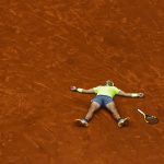 
              FILE - Spain's Rafael Nadal celebrates his record 12th French Open tennis tournament title after winning his men's final match against Austria's Dominic Thiem in four sets, 6-3, 5-7, 6-1, 6-1, at the Roland Garros stadium in Paris, June 9, 2019. The French Open, the year’s second Grand Slam tennis tournament, is scheduled to start Sunday on the red clay of Roland Garros on the outskirts of Paris. (AP Photo/Pavel Golovkin, File)
            