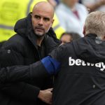 
              Manchester City's head coach Pep Guardiola, left, and West Ham's manager David Moyes greet each other before the start of the English Premier League soccer match between West Ham United and Manchester City at London stadium in London, Sunday, May 15, 2022. (AP Photo/Kirsty Wigglesworth)
            
