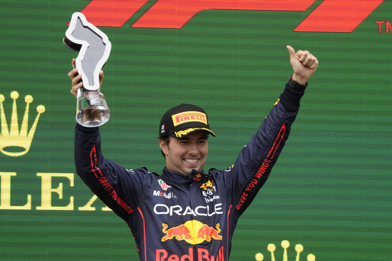 Red Bull driver Sergio Perez of Mexico celebrates on the podium his second place at the Emilia Roma...