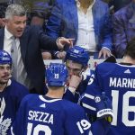 
              Toronto Maple Leafs head coach Sheldon Keefe, top left, calls a timeout while playing against the Tampa Bay Lightning during the third period of Game 7 in an NHL hockey first-round playoff series in Toronto, Saturday, May 14, 2022. (Nathan Denette/The Canadian Press via AP)
            