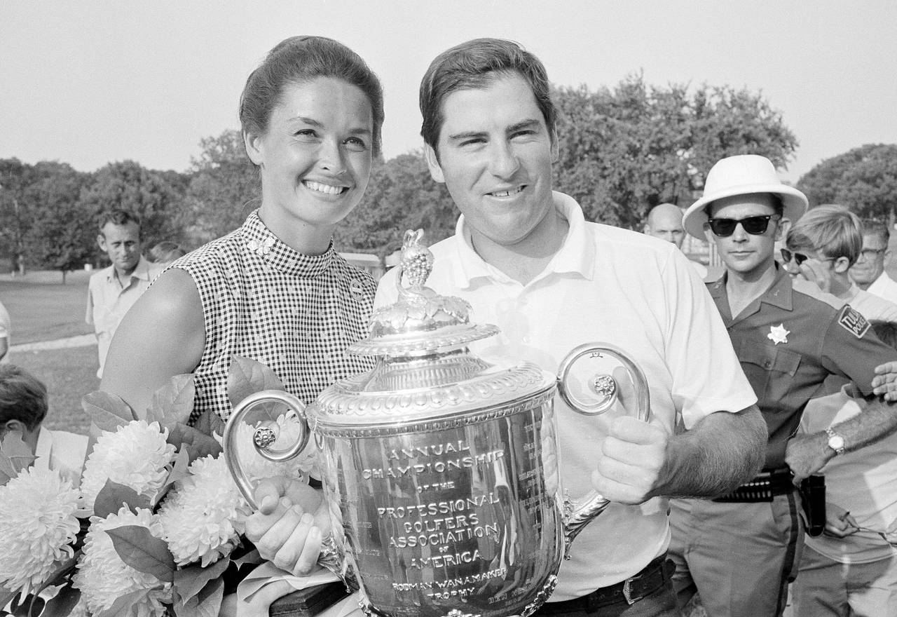 FILE - Dave Stockton of Westlake, Calif., and his wife, Cathy, hold the PGA Championship trophy aft...