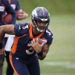 
              Denver Broncos quarterback Russell Wilson takes part in drills at the NFL football team's headquarters Monday, May 23, 2022, in Centennial, Colo. (AP Photo/David Zalubowski)
            