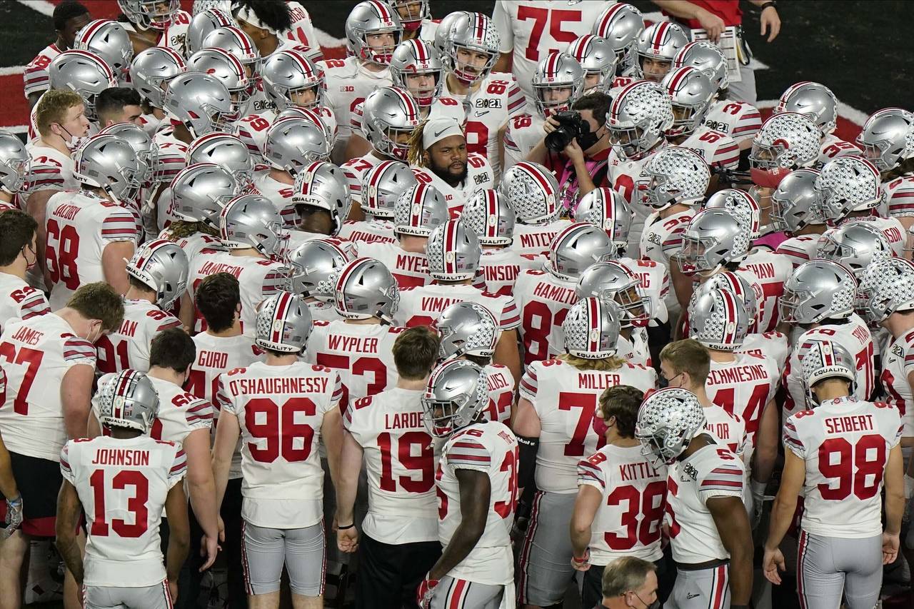 FILE - Ohio State gathers before an NCAA College Football Playoff national championship game agains...