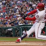 
              Washington Nationals' Juan Soto hits a two-run homer during the first inning of a baseball game against the New York Mets at Nationals Park, Wednesday, May 11, 2022, in Washington. (AP Photo/Alex Brandon)
            