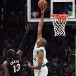 
              Boston Celtics center Al Horford, right, blocks a shot by Miami Heat center Bam Adebayo (13) during the second half of Game 4 of the NBA basketball playoffs Eastern Conference finals, Monday, May 23, 2022, in Boston. (AP Photo/Charles Krupa)
            