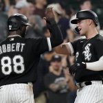 
              Chicago White Sox's Gavin Sheets, left, celebrates with Luis Robert at home after they scored on Sheets' two-run home run off Cleveland Guardians starting pitcher Cal Quantrill during the sixth inning of a baseball game, Tuesday, May 10, 2022, in Chicago. (AP Photo/Charles Rex Arbogast)
            