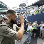 
              FILE - Seattle Sounders forward Clint Dempsey applauds supporters as he walks off the field, Saturday, Sept. 1, 2018, in Seattle, following a pre-match ceremony in his honor after he announced his retirement from professional soccer. Four years removed from playing, Dempsey is set to be inducted into the U.S. National Soccer Hall of Fame on Saturday, May 21, 2022. (AP Photo/Ted S. Warren, File)
            