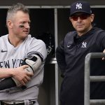 
              New York Yankees' Josh Donaldson, left, talks with manager Aaron Boone in the dugout during the first inning of a baseball game against the Chicago White Sox in Chicago, Sunday, May 15, 2022. (AP Photo/Nam Y. Huh)
            