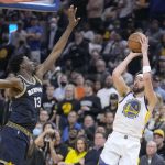 
              Golden State Warriors guard Klay Thompson (11) shoots over Memphis Grizzlies forward Jaren Jackson Jr. (13) during the first half of Game 4 of an NBA basketball Western Conference playoff semifinal in San Francisco, Monday, May 9, 2022. (AP Photo/Tony Avelar)
            