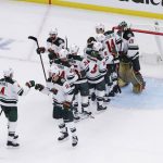 
              The Minnesota Wild celebrate after defeating the St. Louis Blues in Game 3 of an NHL hockey Stanley Cup first-round playoff series Friday, May 6, 2022, in St. Louis. (AP Photo/Michael Thomas)
            