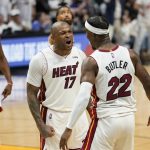 
              Miami Heat forward P.J. Tucker (17) and forward Jimmy Butler (22) celebrate during the second half of Game 1 of an NBA basketball Eastern Conference finals playoff series against the Boston Celtics, Tuesday, May 17, 2022, in Miami. (AP Photo/Lynne Sladky)
            