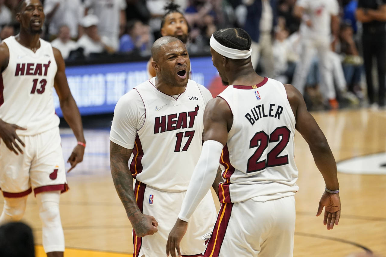 Miami Heat forward P.J. Tucker (17) and forward Jimmy Butler (22) celebrate during the second half ...