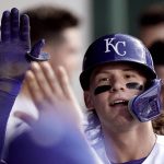 
              Kansas City Royals' Bobby Witt Jr. celebrates in the dugout after hitting a solo home run during the third inning of a baseball game against the Chicago White Sox Wednesday, May 18, 2022, in Kansas City, Mo. (AP Photo/Charlie Riedel)
            