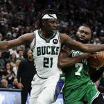 
              Milwaukee Bucks' Jrue Holiday fouls Boston Celtics' Jaylen Brown during the second half of Game 3 of an NBA basketball Eastern Conference semifinals playoff series Saturday, May 7, 2022, in Milwaukee. The Bucks won 103-101 to take a 2-1 lead in the series. (AP Photo/Morry Gash)
            