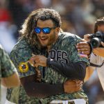 
              From left to right, San Diego Padres' Jorge Alfaro celebrates with Trent Grisham after hitting a two-run walk off home run, defeating the Pittsburgh Pirates 4-2 in the 10th inning of a baseball game, Sunday, May 29, 2022, in San Diego. (AP Photo/Mike McGinnis)
            