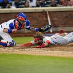 
              St. Louis Cardinals' Brendan Donovan, right, slides past New York Mets catcher Tomas Nido to score on a Paul Goldschmidt double during the fourth inning in the second baseball game of a doubleheader Tuesday, May 17, 2022, in New York. (AP Photo/Frank Franklin II)
            