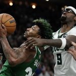 
              Milwaukee Bucks' Bobby Portis fouls Boston Celtics' Marcus Smart during the second half of Game 3 of an NBA basketball Eastern Conference semifinals playoff series Saturday, May 7, 2022, in Milwaukee. The Bucks won 103-101 to take a 2-1 lead in the series. (AP Photo/Morry Gash)
            