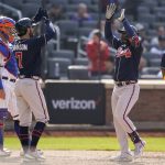 
              Atlanta Braves' Guillermo Heredia, right, celebrates with Dansby Swanson (7) after hitting a two-run home run off New York Mets starting pitcher Trevor Williams (29) in the eighth inning of a baseball game, Wednesday, May 4, 2022, in New York. (AP Photo/John Minchillo)
            