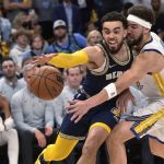 
              Memphis Grizzlies guard Tyus Jones, left, is defended by Golden State Warriors guard Klay Thompson during the second half of Game 2 of a second-round NBA basketball playoff series Tuesday, May 3, 2022, in Memphis, Tenn. (AP Photo/Brandon Dill)
            