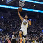 
              Golden State Warriors guard Stephen Curry (30) drives to the basket against the Memphis Grizzlies during the first half of Game 4 of an NBA basketball Western Conference playoff semifinal in San Francisco, Monday, May 9, 2022. (AP Photo/Tony Avelar)
            