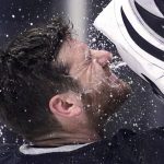 
              Los Angeles Kings goaltender Jonathan Quick sprays his face with water prior to the first period in Game 4 of an NHL hockey Stanley Cup first-round playoff series against the Edmonton Oilers Sunday, May 8, 2022, in Los Angeles. (AP Photo/Mark J. Terrill)
            