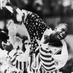 
              HOLD FOR OBIT-FILE - In this Aug. 8, 1992 photo taken by Associated Press photographer Leonard Ignelzi shows U.S. basketball player Earvin Magic Johnson screams as he lifts the American flag just after receiving his gold medal in Barcelona, Spain. Ignelzi, whose knack for being in the right place at the right time produced breathtaking images of Hall of Fame sports figures, life along the U.S.-Mexico border, devastating wildfires and numerous other major news events over nearly four decades as a photographer for The Associated Press in San Diego, has died. He was 74. (AP Photo/Lenny Ignelzi)
            