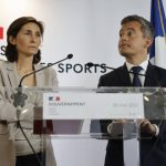 
              Sports Minister Amélie Oudéa-Castéra, left, and French Interior Minister Gerald Darmanin attend a press conference following a meeting on security after incidents during the Champions League final at the Stade France stadium, Monday, May 30, 2022 in Paris. The British government says it's deeply concerned over the treatment of Liverpool supporters by French authorities, who blamed fans for unrest at the Champions League final amid overcrowding outside the Stade de France. (AP Photo/Jean-Francois Badias)
            