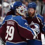 
              Colorado Avalanche left wing J.T. Compher (37) celebrates with goaltender Pavel Francouz (39) after the team's 8-6 win over the Edmonton Oilers in Game 1 of the NHL hockey Stanley Cup playoffs Western Conference finals Tuesday, May 31, 2022, in Denver. (AP Photo/Jack Dempsey)
            