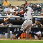 
              Houston Astros' Jose Altuve hits a double, driving in two runs against Minnesota Twins pitcher Cody Stashak during the sixth inning of a baseball game that was suspended after three innings Wednesday due to severe weather, Thursday, May 12, 2022, in Minneapolis. (AP Photo/Craig Lassig)
            