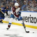 
              Colorado Avalanche's Erik Johnson handles the puck during the second period in Game 3 of an NHL hockey Stanley Cup second-round playoff series against the St. Louis Blues Saturday, May 21, 2022, in St. Louis. (AP Photo/Jeff Roberson)
            