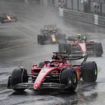 
              Cars warm up under an heavy rainfall prior to the start of the Monaco Formula One Grand Prix, at the Monaco racetrack, in Monaco, Sunday, May 29, 2022. (AP Photo/Daniel Cole)
            