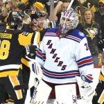 
              Pittsburgh Penguins' Jeff Carter, second from left, celebrates his goal during the second period in Game 4 of an NHL hockey Stanley Cup first-round playoff series as New York Rangers goaltender Igor Shesterkin (31) collects himself in Pittsburgh, Monday, May 9, 2022. (AP Photo/Gene J. Puskar)
            