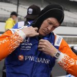 
              Scott Dixon, of New Zealand, puts on his equipment during qualifications for the Indianapolis 500 auto race at Indianapolis Motor Speedway, Saturday, May 21, 2022, in Indianapolis. (AP Photo/Darron Cummings)
            