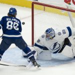 
              Tampa Bay Lightning goaltender Andrei Vasilevskiy (88) makes a save on Toronto Maple Leafs right wing William Nylander (88) during the second period of Game 5 of an NHL hockey Stanley Cup first-round playoff series, Tuesday, May 10, 2022 in Toronto. (Frank Gunn/The Canadian Press via AP)
            
