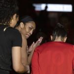 
              Las Vegas Aces forward A'ja Wilson claps with teammates before a WNBA basketball game against the Phoenix Mercury, Saturday, May 21, 2022, in Las Vegas. (AP Photo/Ellen Schmidt)
            