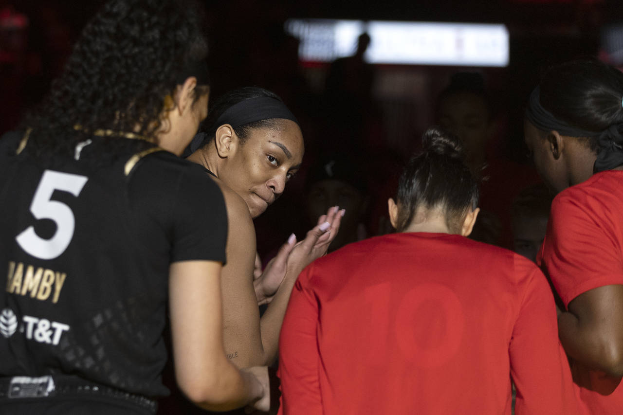 Las Vegas Aces forward A'ja Wilson claps with teammates before a WNBA basketball game against the P...