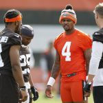 
              Cleveland Browns quarterback Deshaun Watson (4) talks with teammates in a huddle during NFL football practice at the team's training facility Wednesday, May 25, 2022, in Berea, Ohio. (AP Photo/Ron Schwane)
            