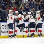 
              Members of the Florida Panthers wait during a video review on what was originally called a goal by Tampa Bay Lightning left wing Alex Killorn during the second period in Game 4 of an NHL hockey second-round playoff series Monday, May 23, 2022, in Tampa, Fla. The goal was overturned. (AP Photo/Chris O'Meara)
            