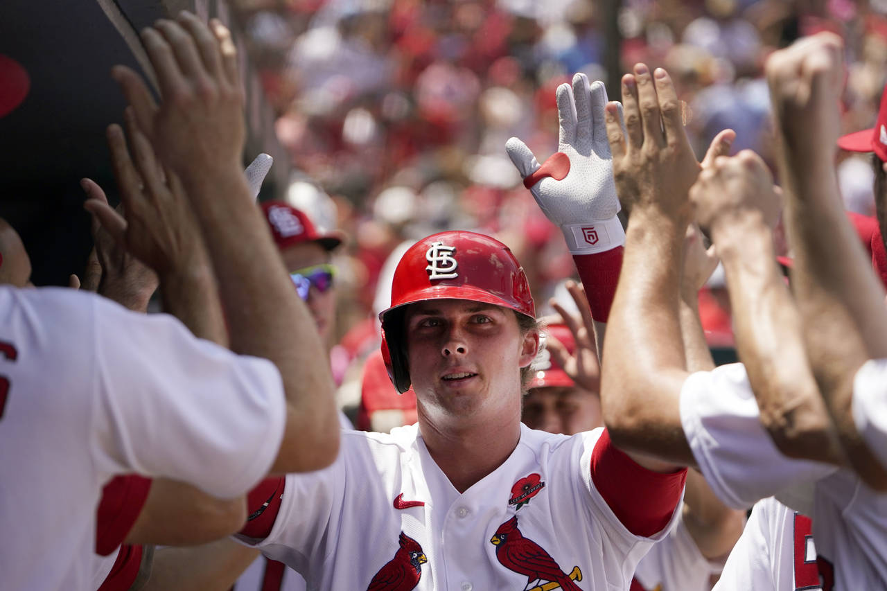St. Louis Cardinals' Nolan Gorman is congratulated by teammates after hitting a two-run home run du...