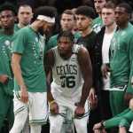 
              Boston Celtics' Marcus Smart come back on the court after leaving temporarily with an injury during the second half of Game 3 of the team's NBA basketball playoffs Eastern Conference finals against the Miami Heat, Saturday, May 21, 2022, in Boston. (AP Photo/Michael Dwyer)
            