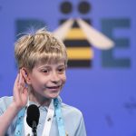 
              Miles Hubbert, 10, from Centreville, Md., listens to his word during the Scripps National Spelling Bee, Tuesday, May 31, 2022, in Oxon Hill, Md. (AP Photo/Alex Brandon)
            